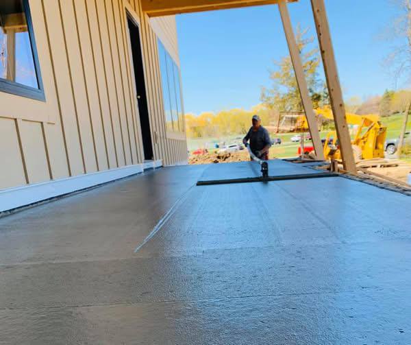 Finished concrete slab beneath a covered exterior structure